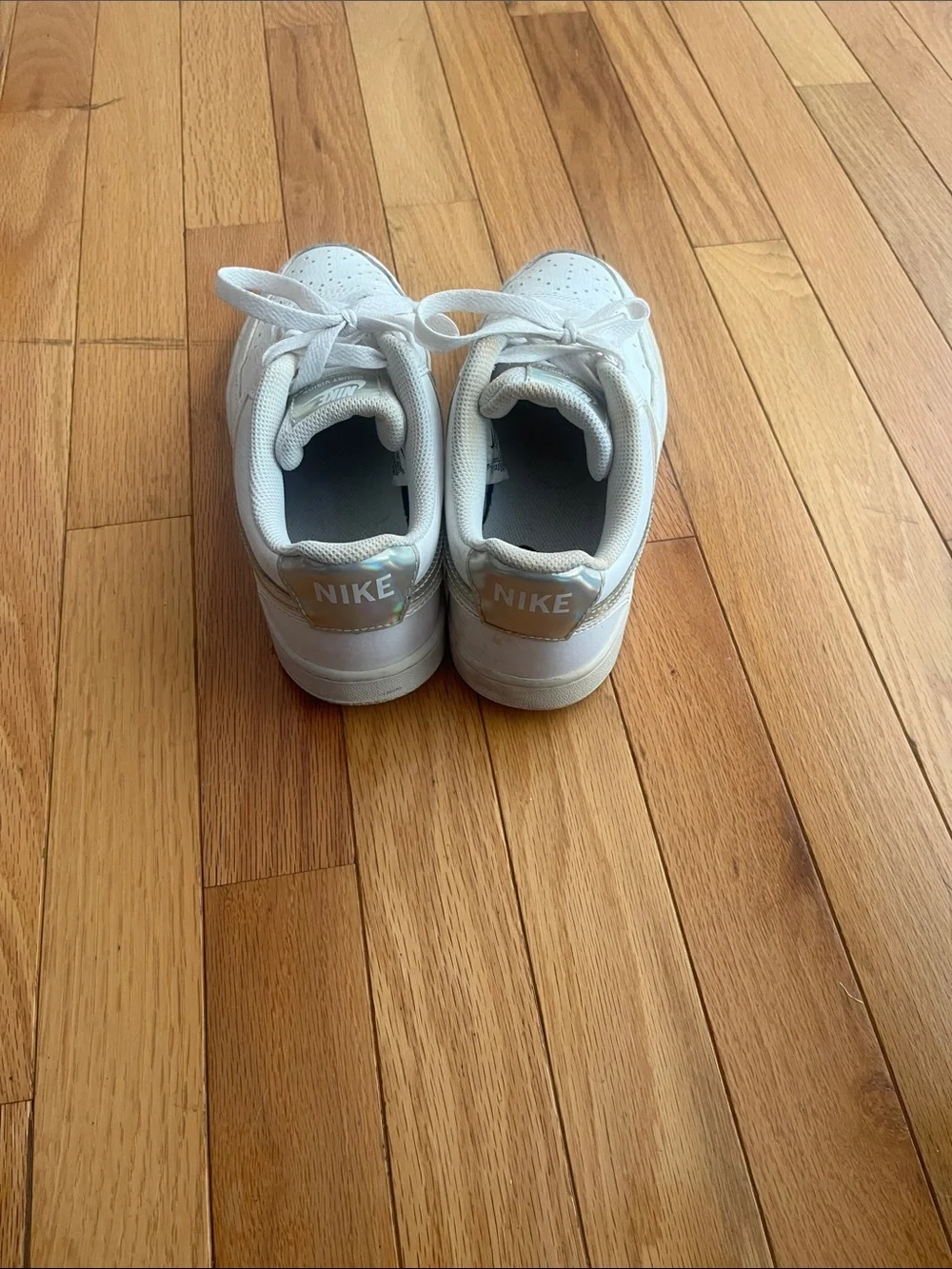 Nike White Low-Top Sneakers with Silver Swoosh Accent